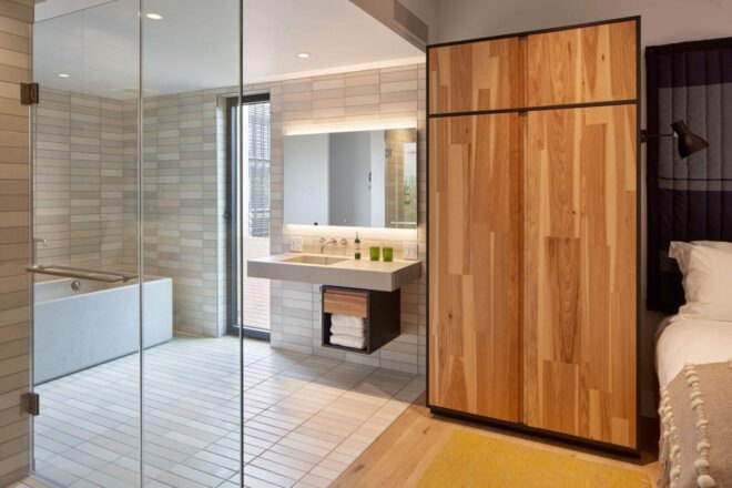 hotel bathroom with glass wall
