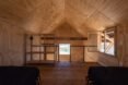 lofted bedroom with two beds