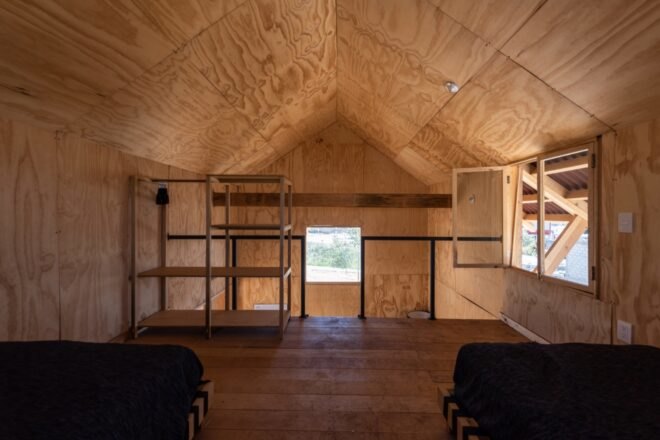 lofted bedroom with two beds