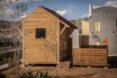 small timber home near concrete home