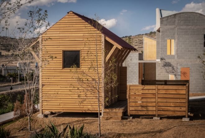 small timber home near concrete home