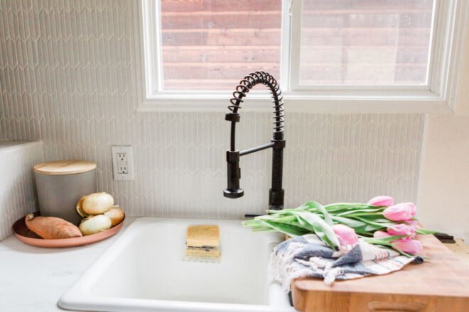 white sink with curved faucet