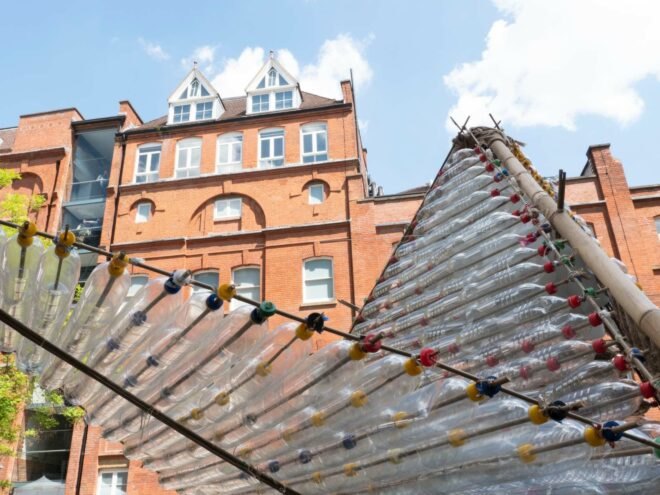 close-up of triangular door made of plastic bottles