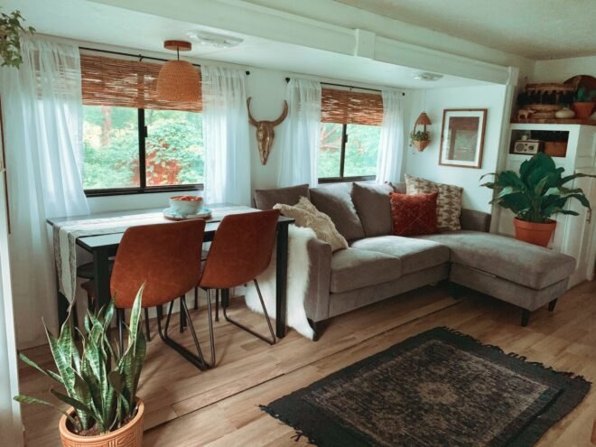 camper interior with gray sofa and bohemian decor
