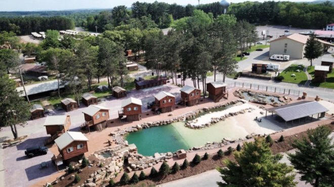 wooden cabins surrounding a lagoon