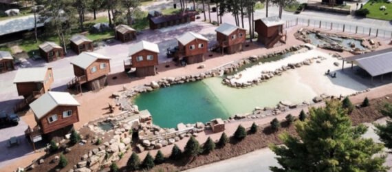 wooden cabins surrounding a lagoon