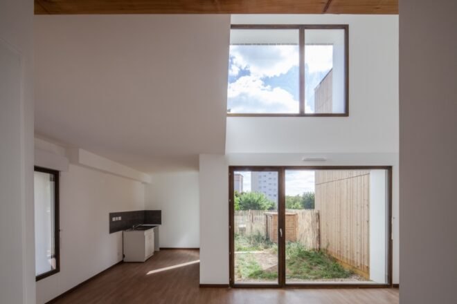 interior of home with white walls and large windows