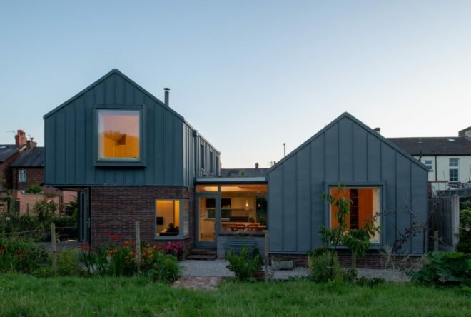 zinc and brick home at dusk