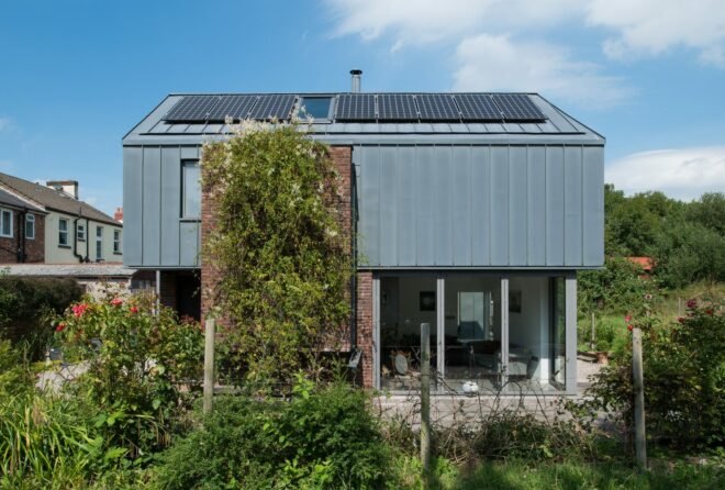 gray building with solar panels on the roof