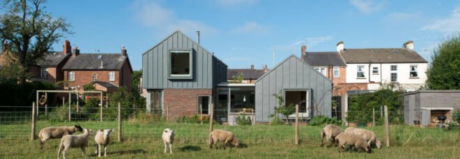 brick home with gray gabled roof