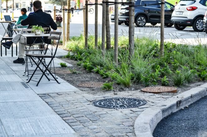 storm drain inside sidewalk tiles