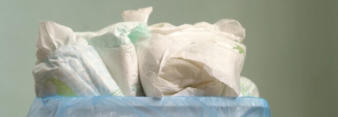 disposable diapers in a garbage bin
