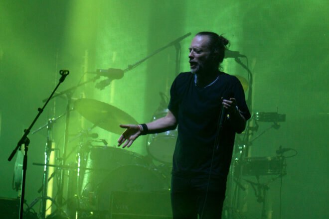 Thom Yorke of Radiohead singing on stage