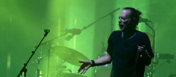Thom Yorke of Radiohead singing on stage
