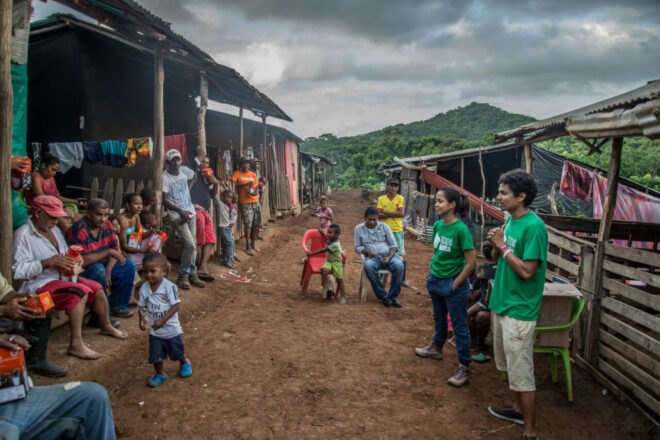 Tierra Grata team talking to a community