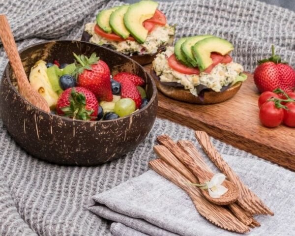 picnic set up with vegan salad and fruit on a blanket