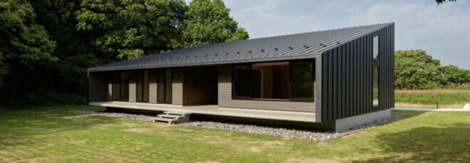 black timber home with mono-pitched roof