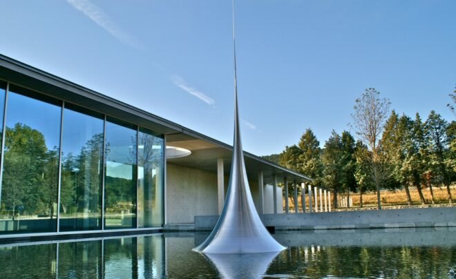 spire sculpture sticking out of water