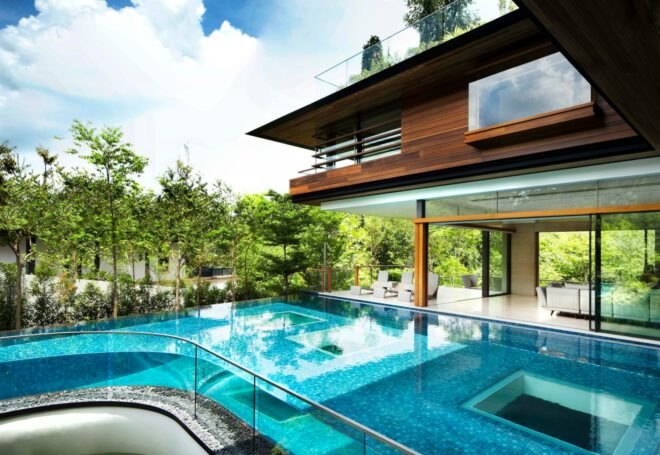 outside deck of home with curving swimming pool