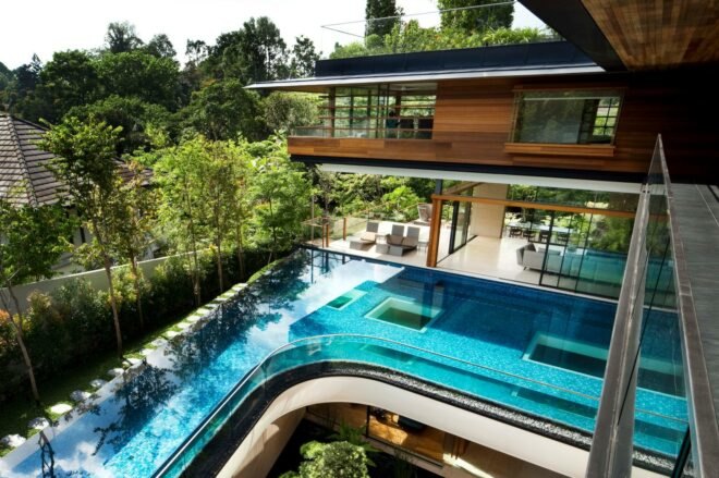outside deck of home with large swimming pool