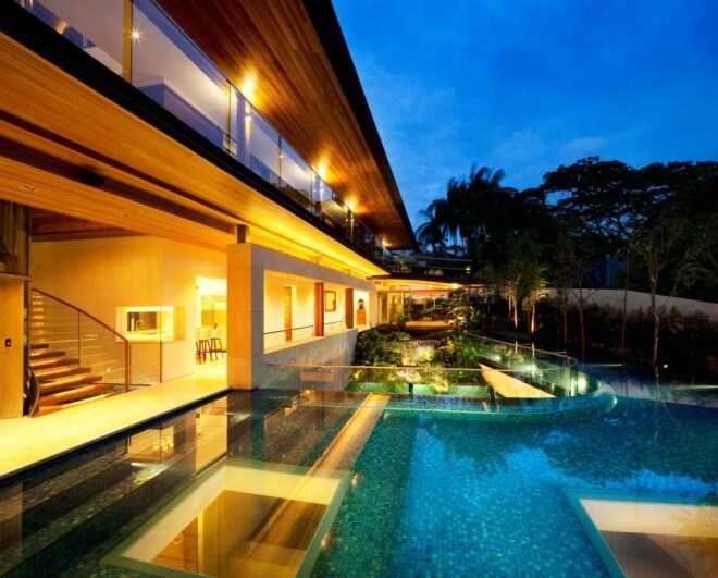 outside deck of home with large wrap-around swimming pool