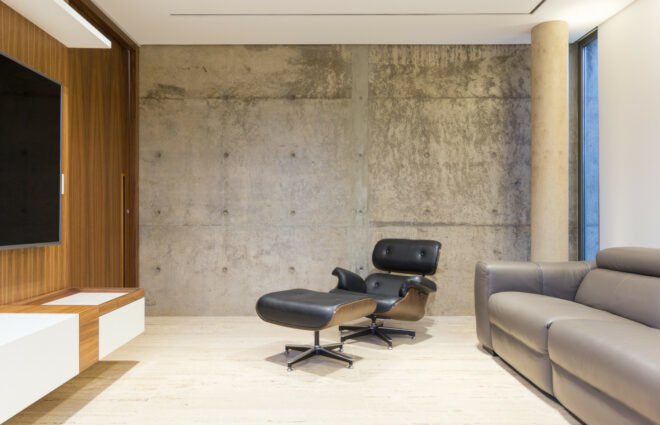 minimalistic living space with concrete walls