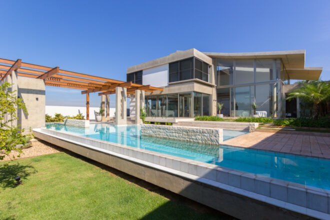 concrete home with swimming pool