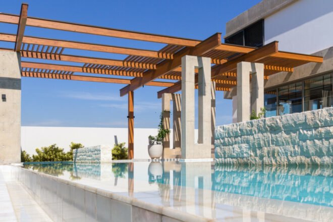 concrete home with swimming pool