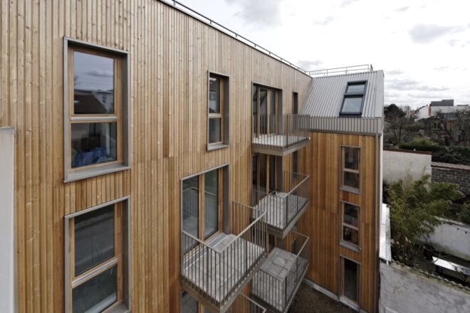wood apartment building with balconies