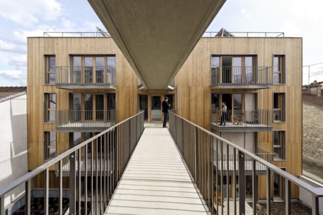 wood walkway between buildings