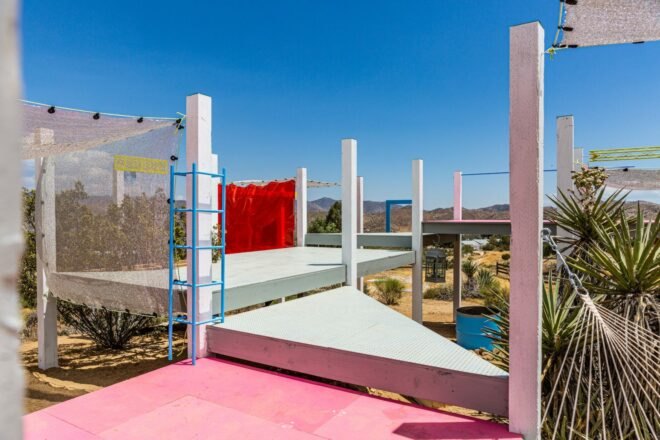 white and pink platform in a desert