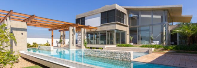 concrete home with swimming pool