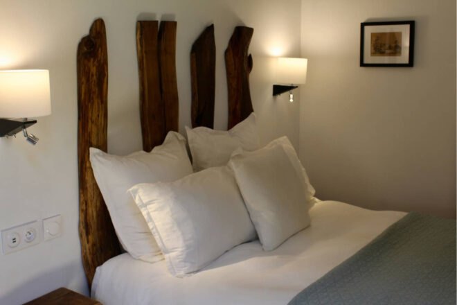 bed with wooden planks as headboard