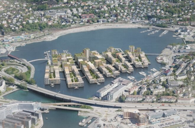 aerial rendering of green-roofed buildings on a lake