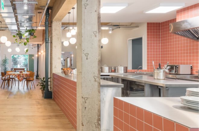open kitchen with red tiled walls