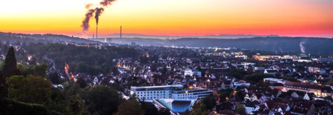 smog fills a city at sunset
