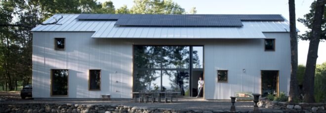 white home with solar panels on roof