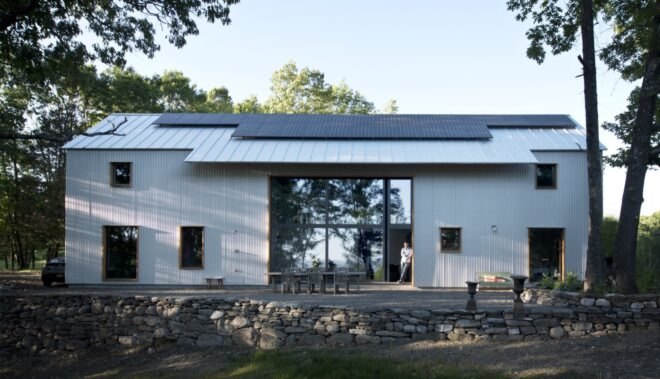 white home with solar panels on roof