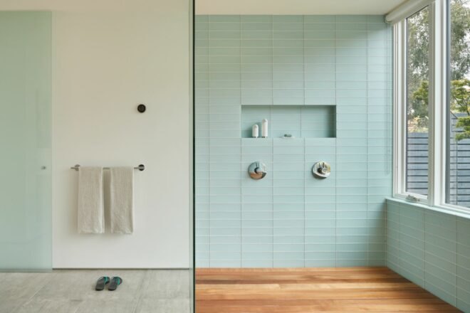 large shower with all white tiling