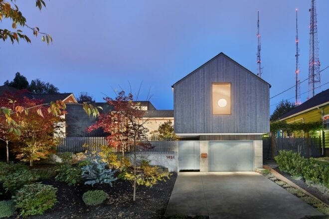 driveway leading up to pitched-roofed home
