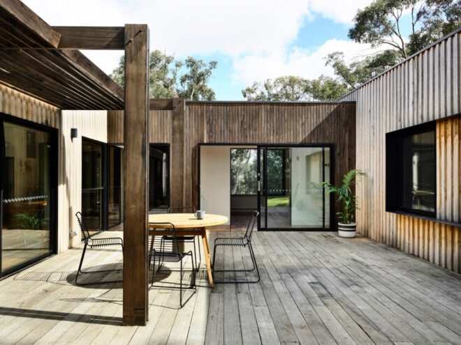light timber courtyard with small table and chairs