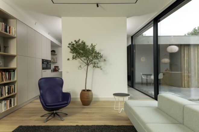 living area with white sofa and dark blue chair