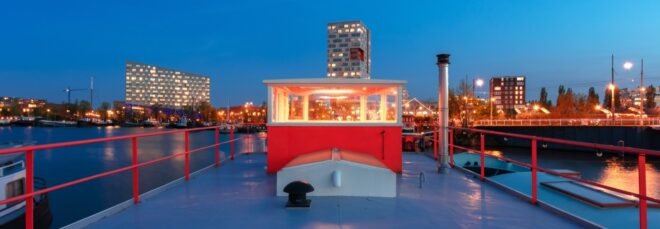 red exterior of room atop a houseboat