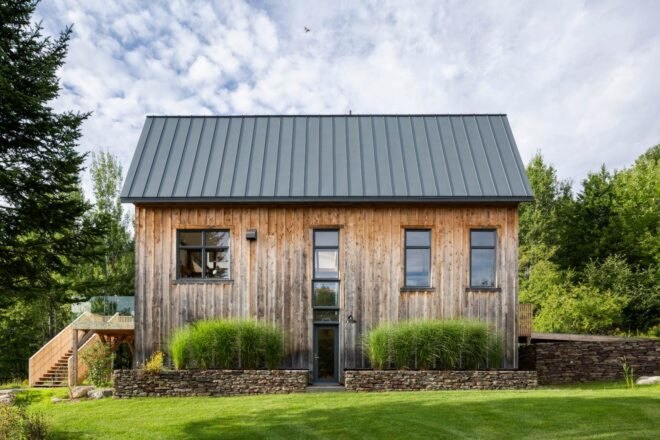large barn home on green hill