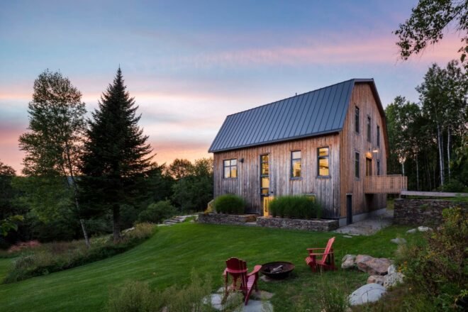 large barn home on green hill