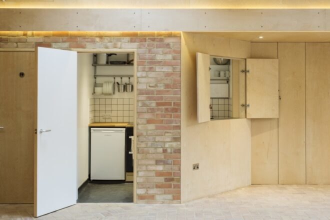 building with brick walls and open wood compartments in the wall