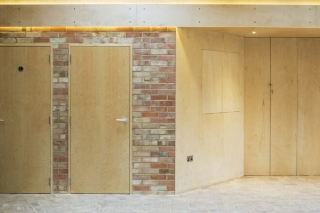 building with brick walls and closed wood compartments in the wall