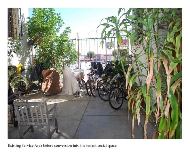 "Before" image of courtyard covered in bikes and debris
