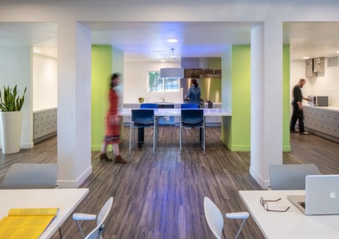 indoor area with wood floors and white tables