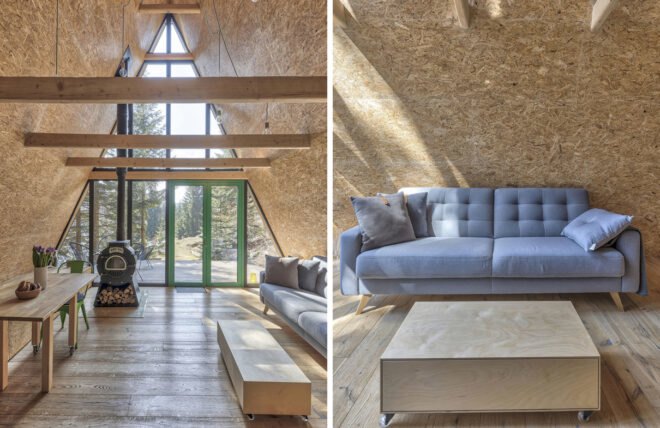 wood-lined room with gray sofa and wood-burning fireplace
